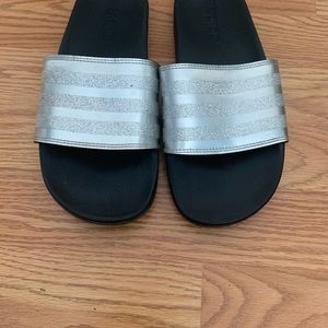 Black and glitter silver Adidas slides